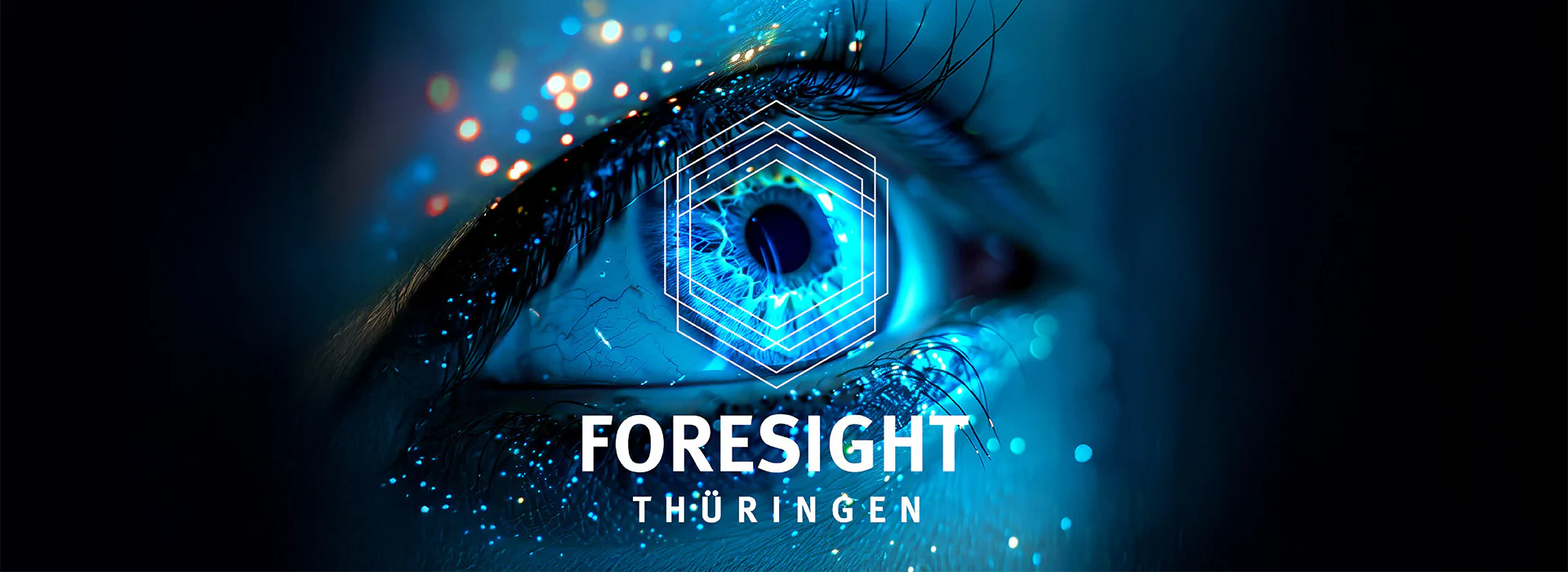 Bildbeschreibung / description: Blaues Auge mit bunten Farbklecksen unter blauem Licht