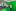 Vier Personen posieren vor einem Green-Screen und lächeln in die Kamera.